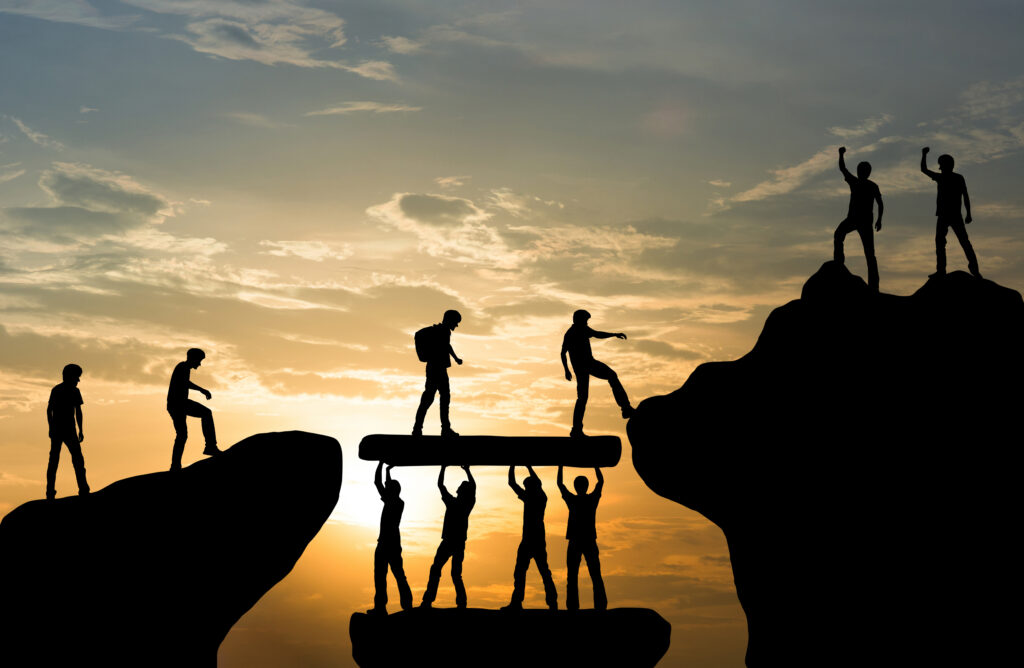Symbolic illustration of teamwork, trust, and overcoming challenges together.